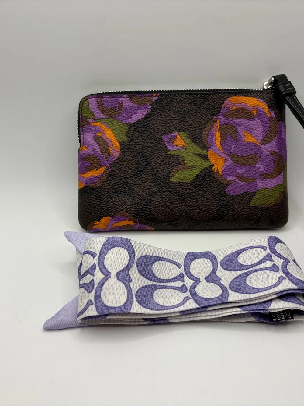 COACH Brown Signature Floral Wristlet with Purple and Orange Accents with coach